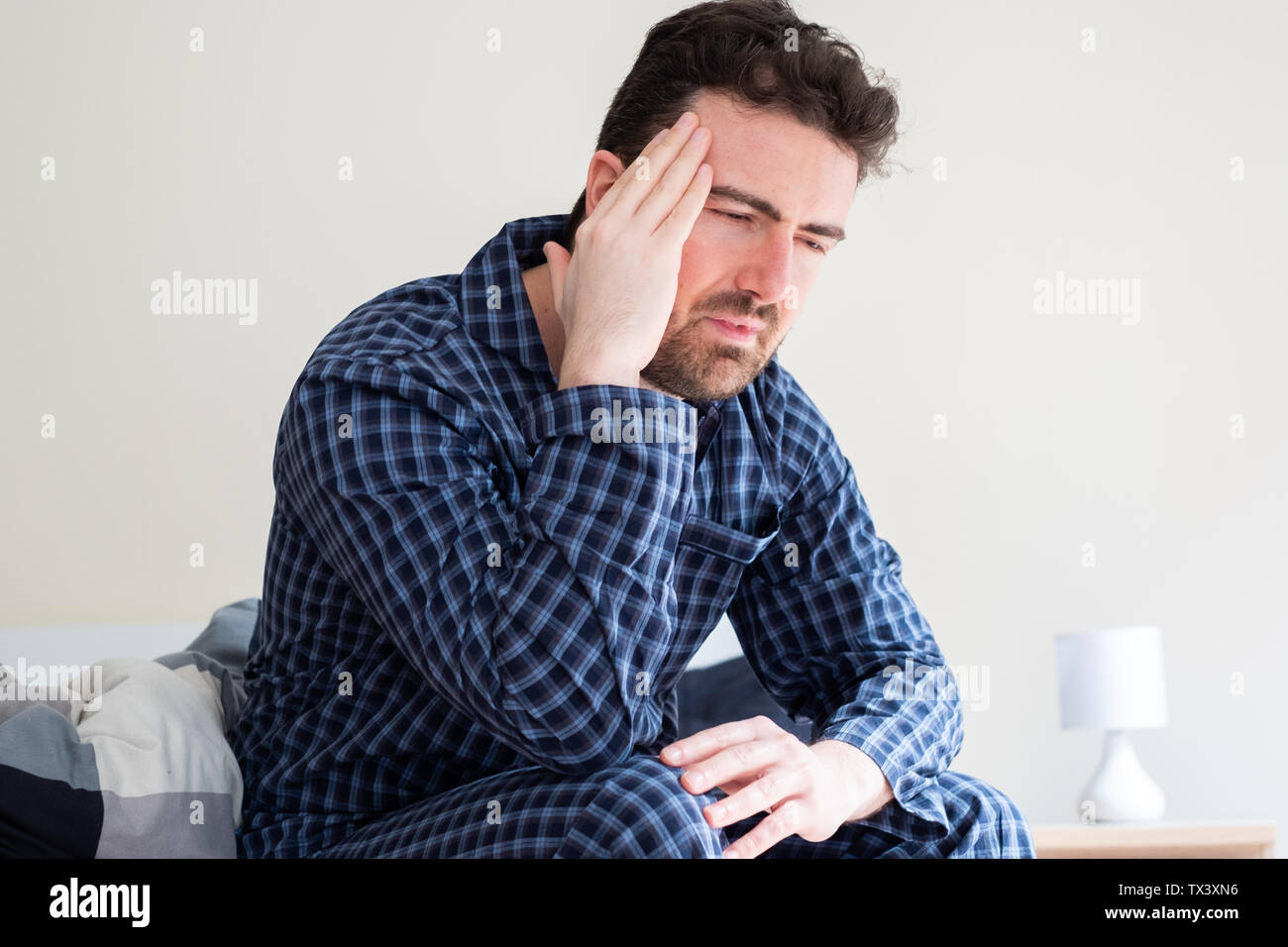 Man is feeling headache and can't sleep Stock Photo Alamy