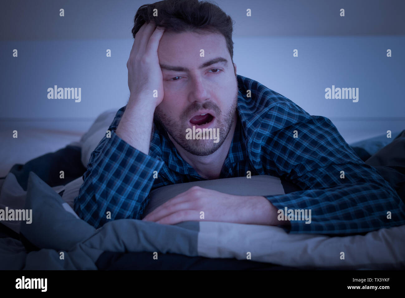 Tired man don't want to wake up Stock Photo