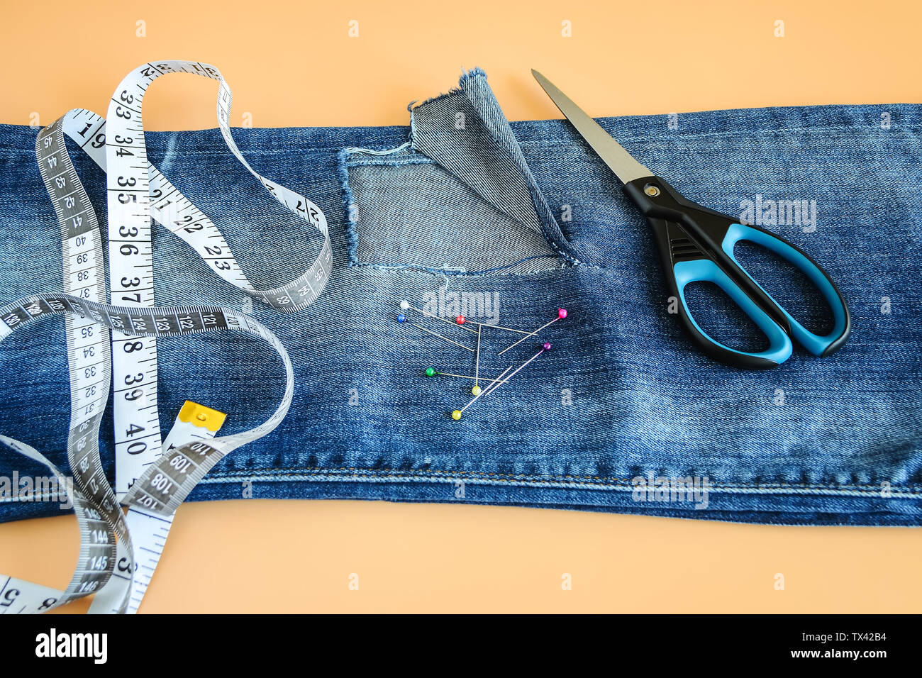 jeans with holes below the knee