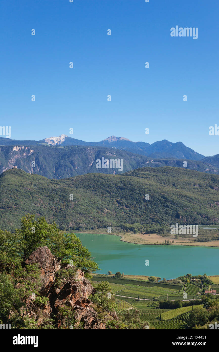 Italy, South Tyrol, view over vineyards and Kalterer See with Leuchtenburg Castle Stock Photo