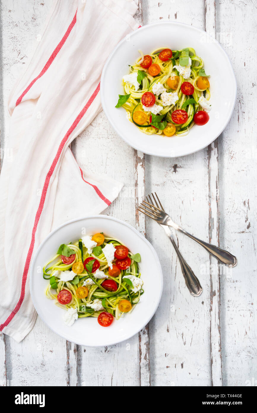 Zoodles salad with tomatoes, Buffalo Mozzarella and basil Stock Photo