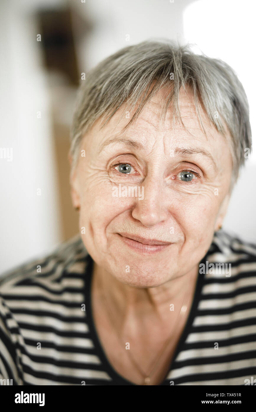 Portrait Of Happy Senior Woman With Short Hair Smiling With Tears
