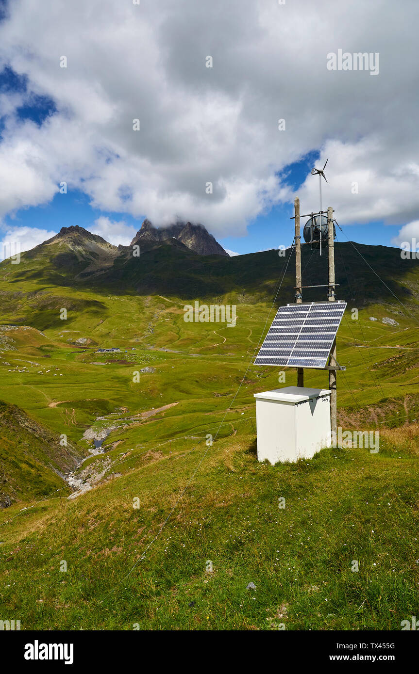 Meteorological station with solar panel in high mountain pastures with Col de Peyreget peak (Col du Pourtalet, Portalet, Laruns, Pyrenees, France) Stock Photo