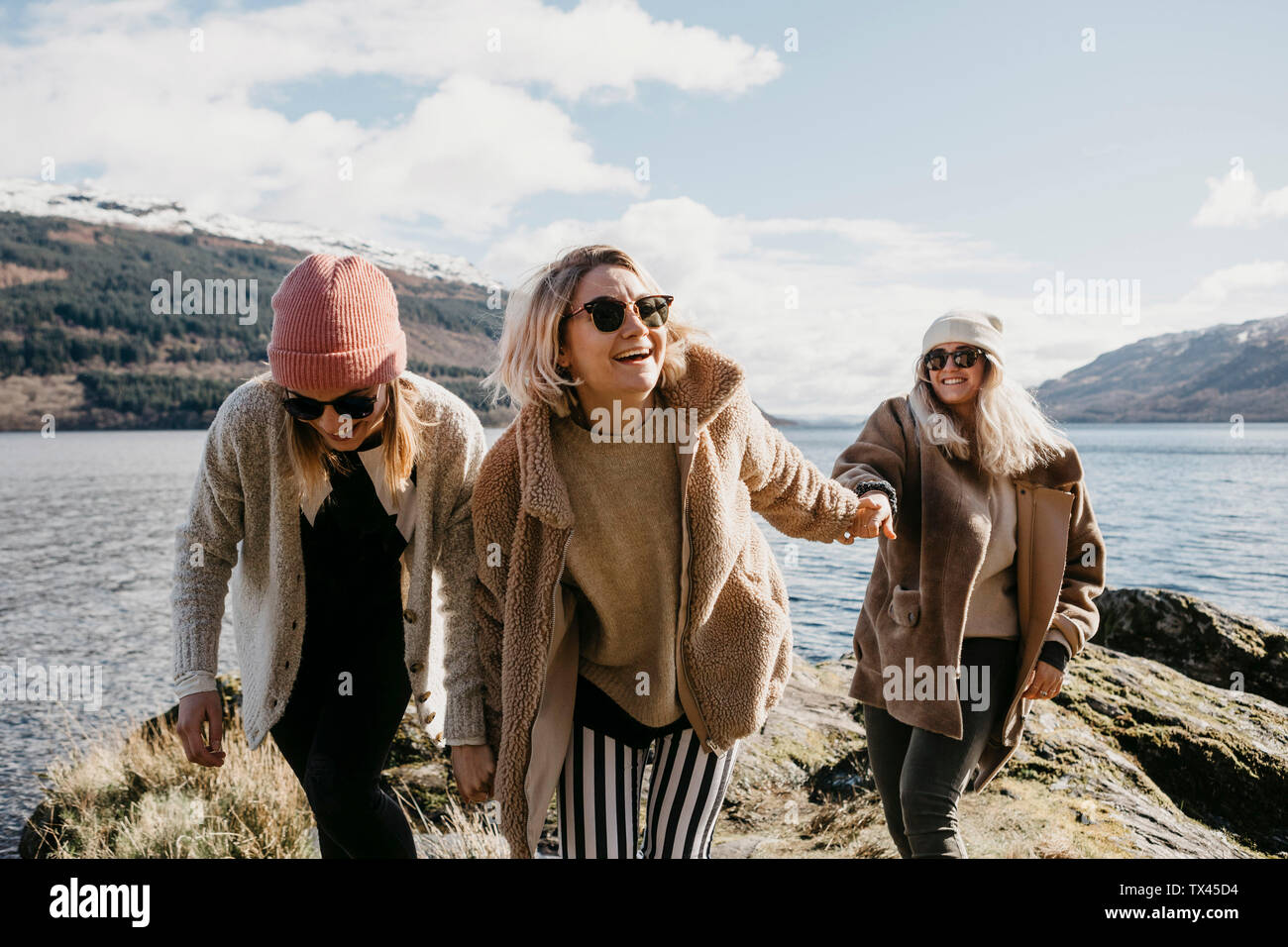 UK, Scotland, happy female friends at Loch Lomond Stock Photo