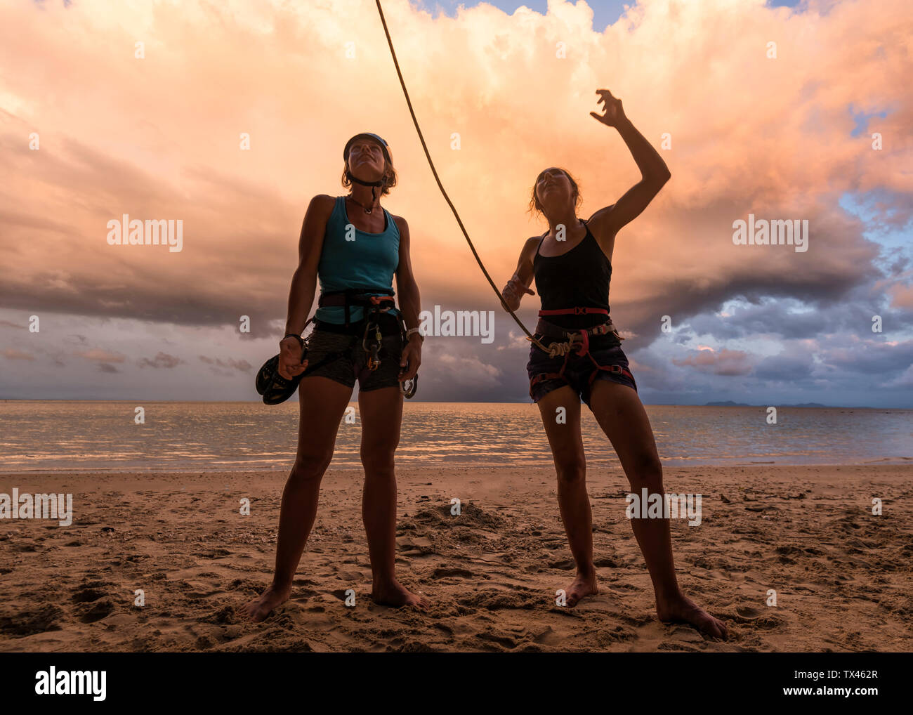 Thailand, Krabi, Lao Liang island, two female climbers discussing on the beach Stock Photo