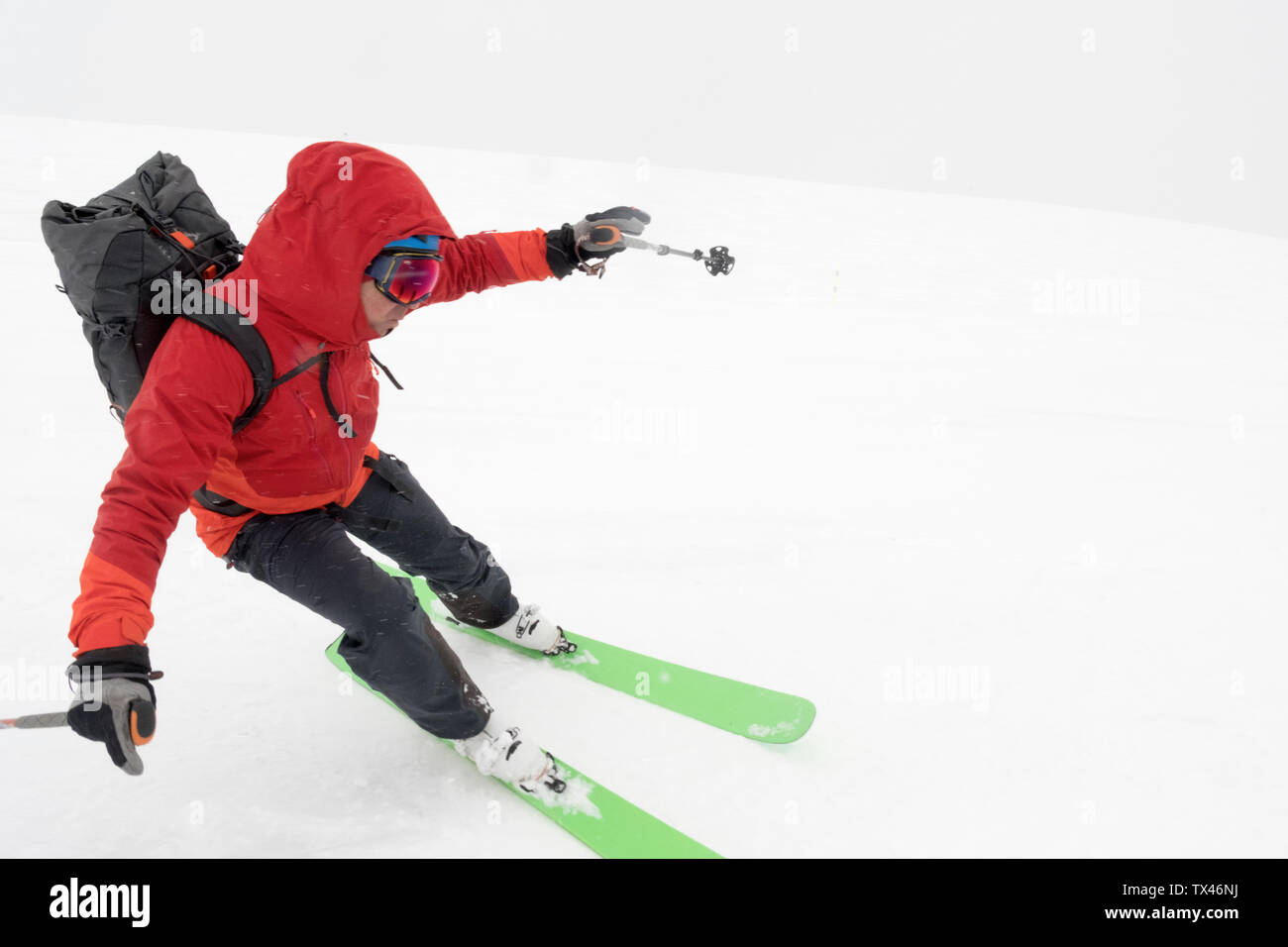 Georgia, Caucasus, Gudauri, man on a ski tour riding downhill Stock Photo