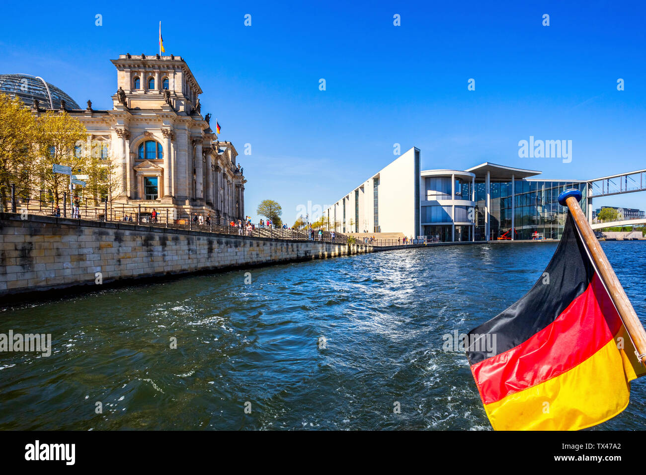 Germany, Berlin, Reichstag with Spree and German Flag Stock Photo