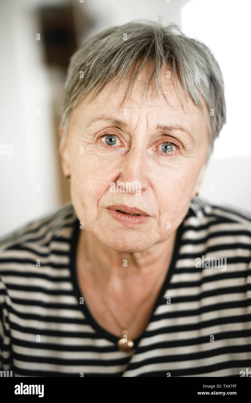 Portrait of senior woman with short hair, respectable looking in camera Stock Photo
