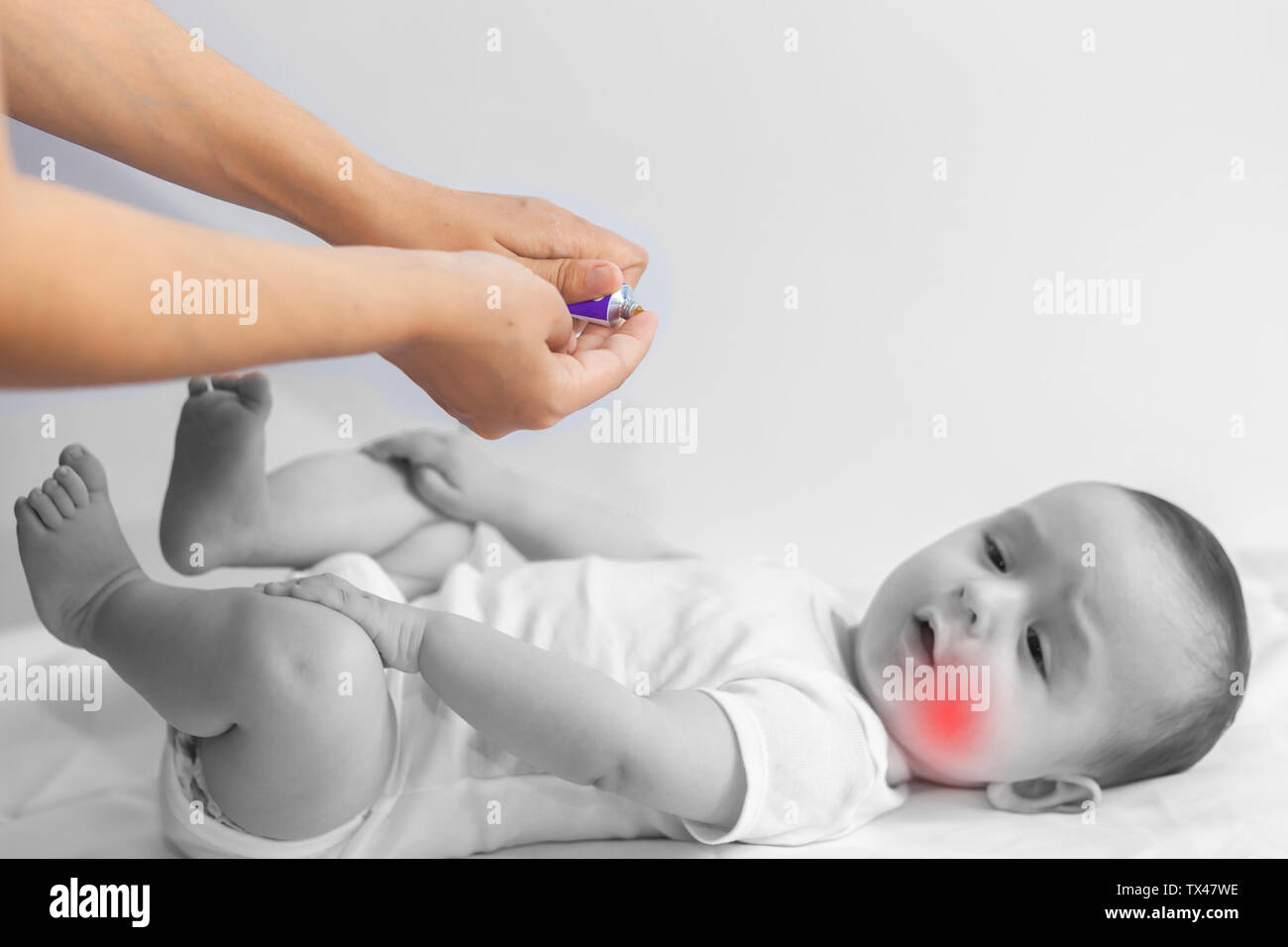 Baby boy teething pain. Little 6month baby having teeth pains. Mother