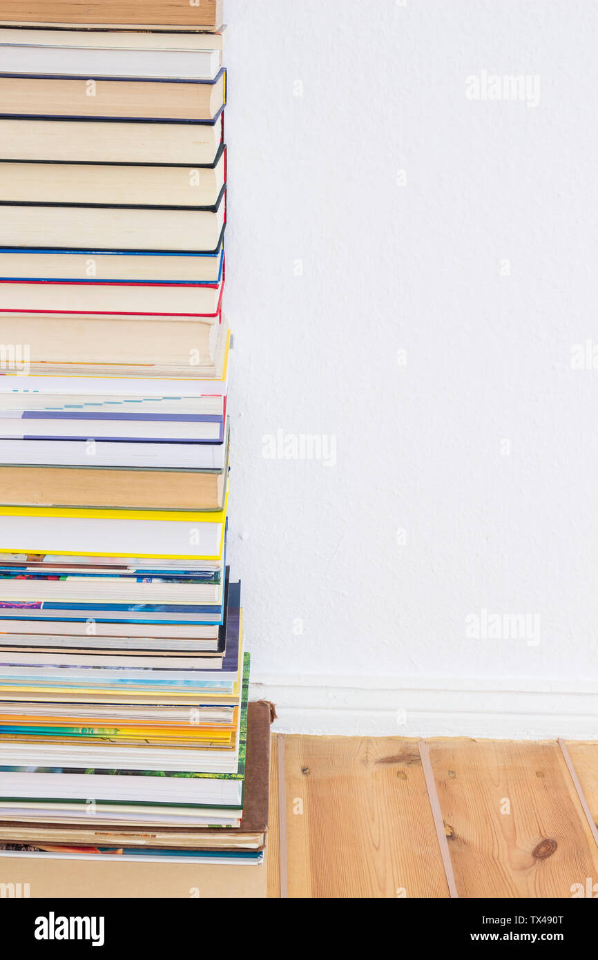 Stack of books on floor Stock Photo Alamy
