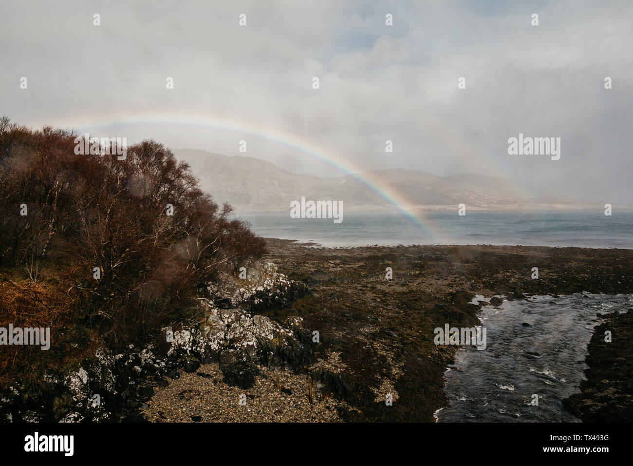 UK, Scotland, Highland, rainbow above the sea Stock Photo