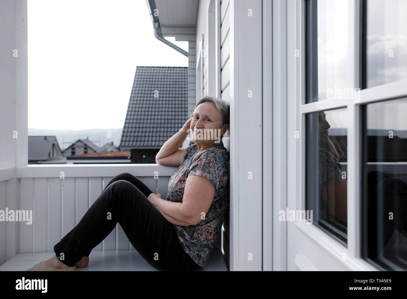 Sitting on porch hi-res stock photography and images - Alamy