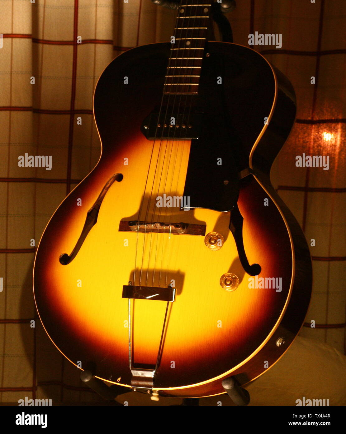 GIBSON ES-125 1955 Available: 1941 to 1970 (a student model at best). ES-125 specs: 16 1/4 wide, approximately 3.5 thick body,  P-90 pickup with dog ears with adjustable poles. pickup in neck position,  tortoise grain pickguard,  plain tailpiece, single bound top and back,  dot fingerboard inlays,  silkscreen logo,  sunburst finish.; 2008; Own work; matanao; Stock Photo