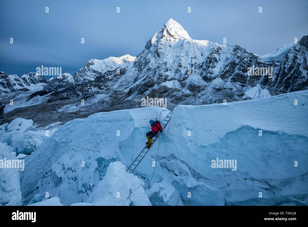 Nepal, Solo Khumbu, Mountaineer at Everest Icefall, Pumori in background Stock Photo