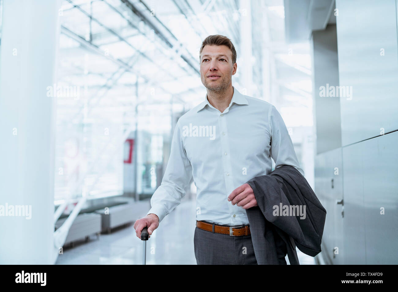 Businessman with baggage at the airport Stock Photo