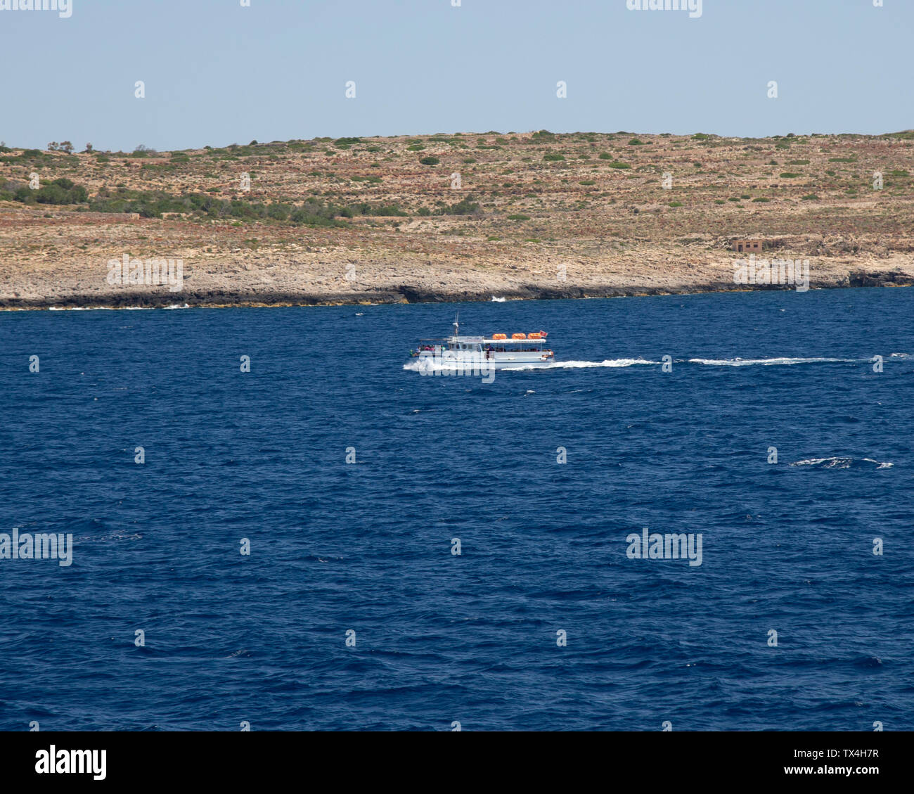 One of the ferries connecting Comino, Gozo, and Malta Stock Photo