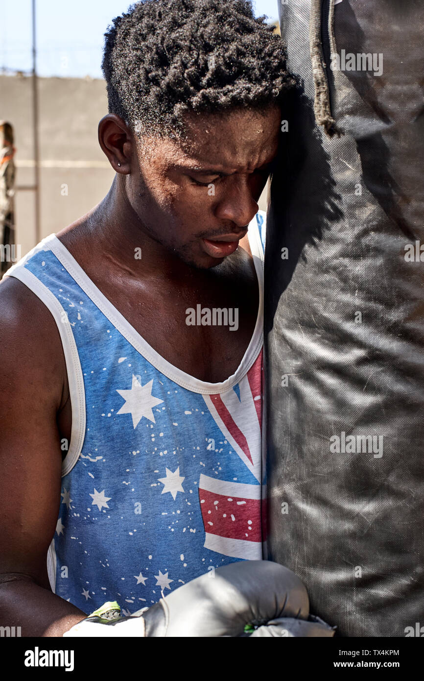 Boxer at punching bag Stock Photo