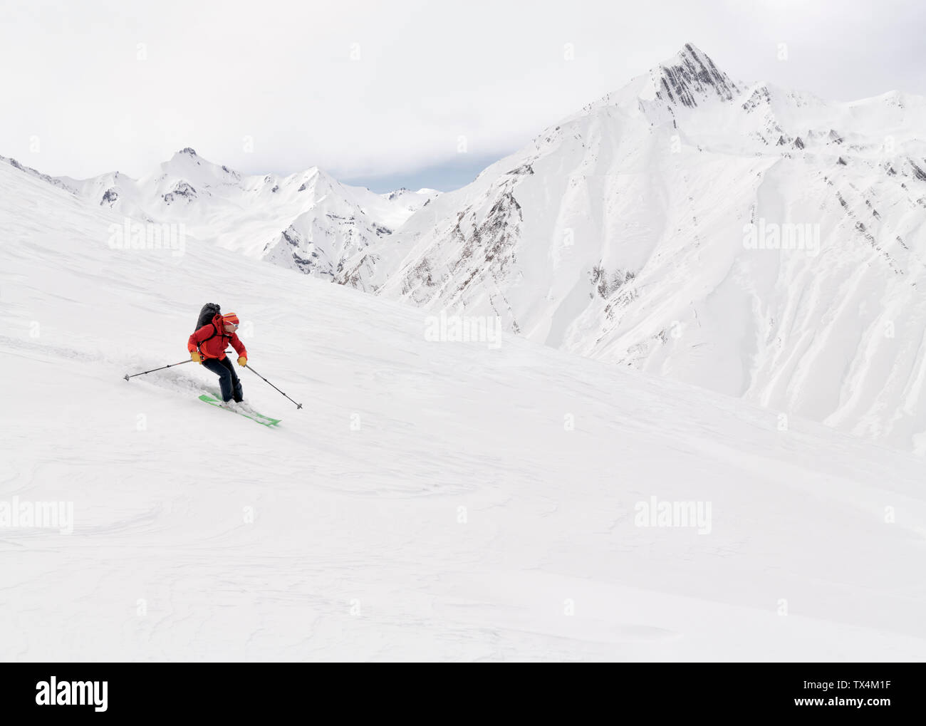 Georgia, Caucasus, Gudauri, man on a ski tour riding downhill Stock Photo