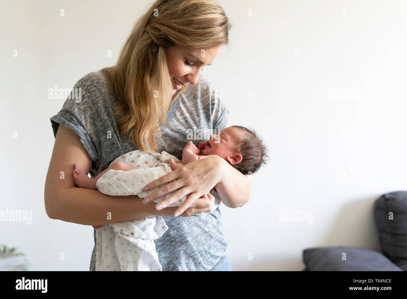 Mother holding her newborn baby Stock Photo - Alamy