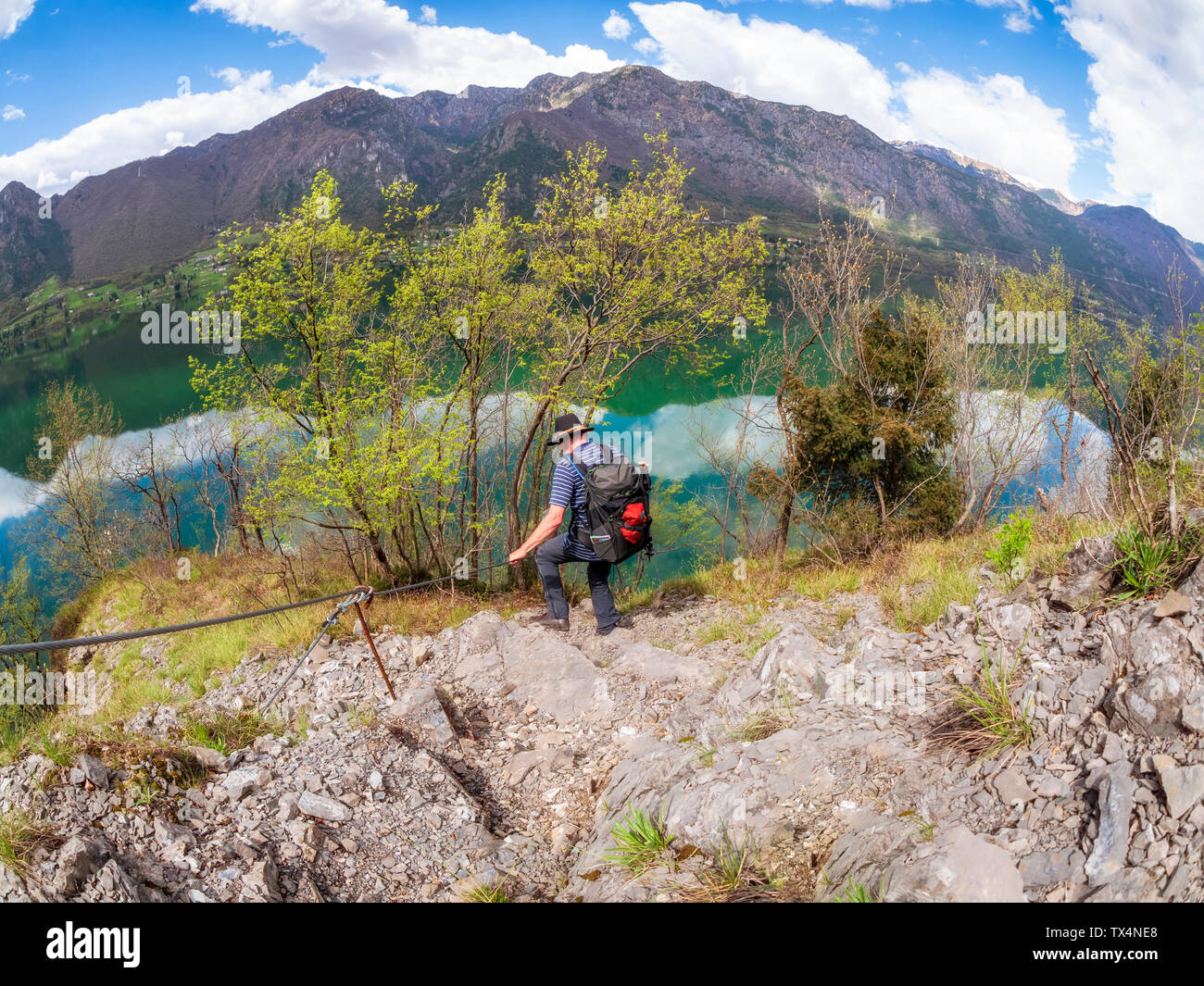Italy, Lombardy, hiker during descent Stock Photo