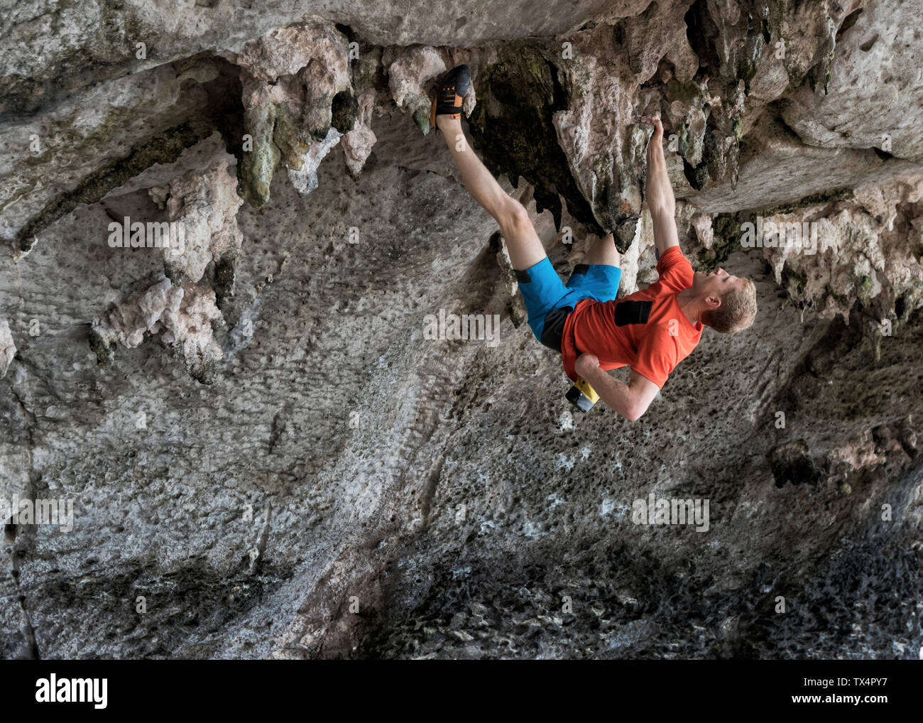 Thailand, Krabi, Lao liang island, man bouldering in rock wall Stock Photo