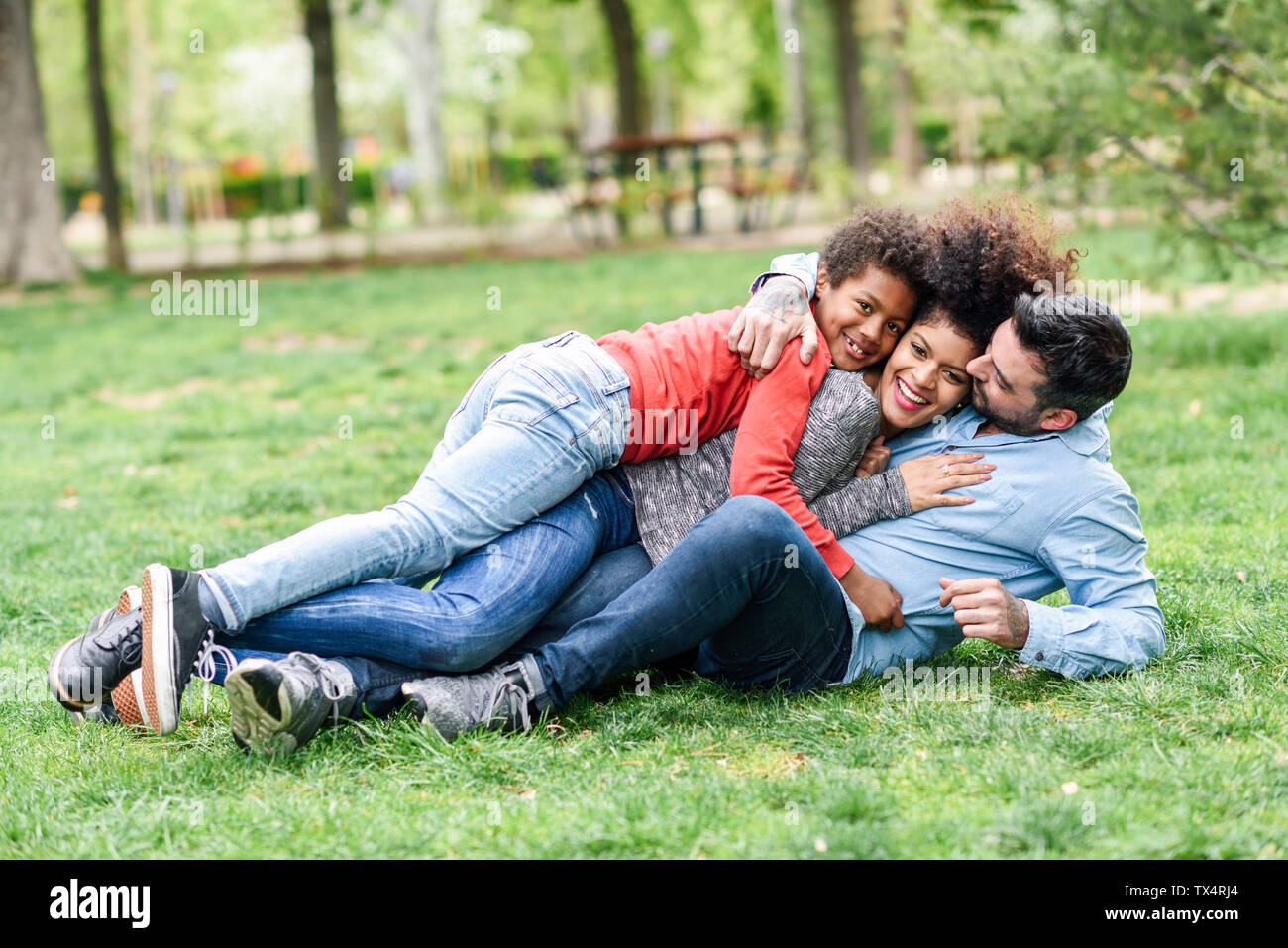 Happy children lying in grass hi-res stock photography and images - Alamy