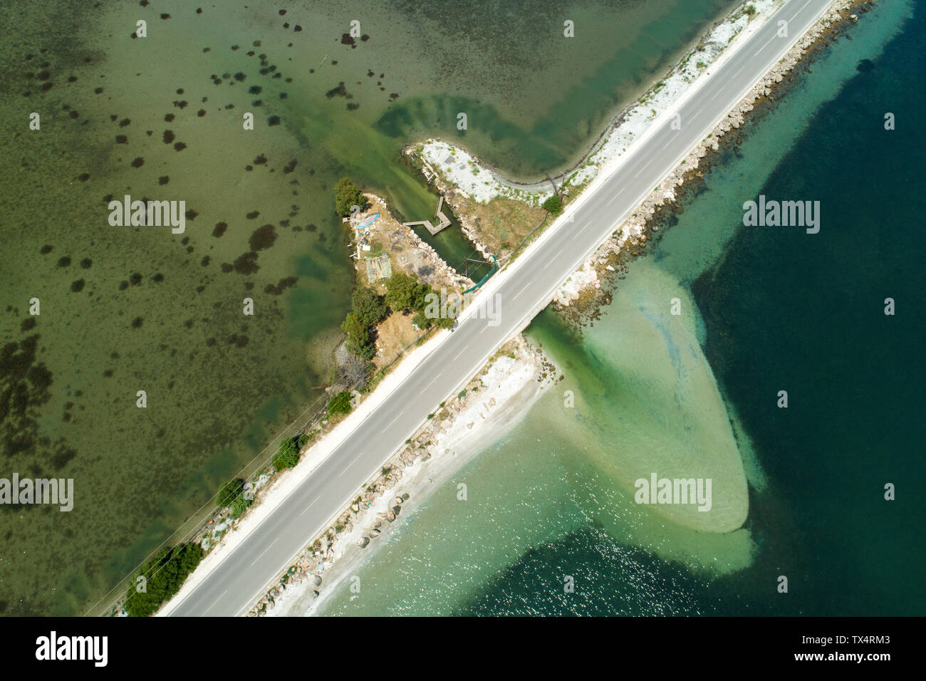 Greece, Igoumenitsa, aerial view of road and bridge in the sea at Ormos Valtou Stock Photo