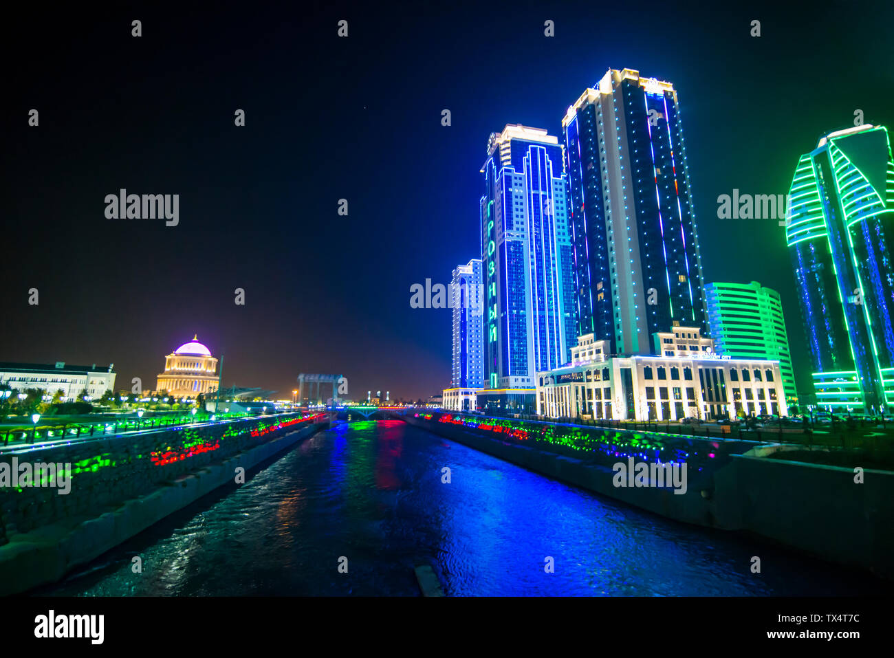 Business district of Grozny colourfulyl lluminated at night, Grozny, Chechnya Stock Photo