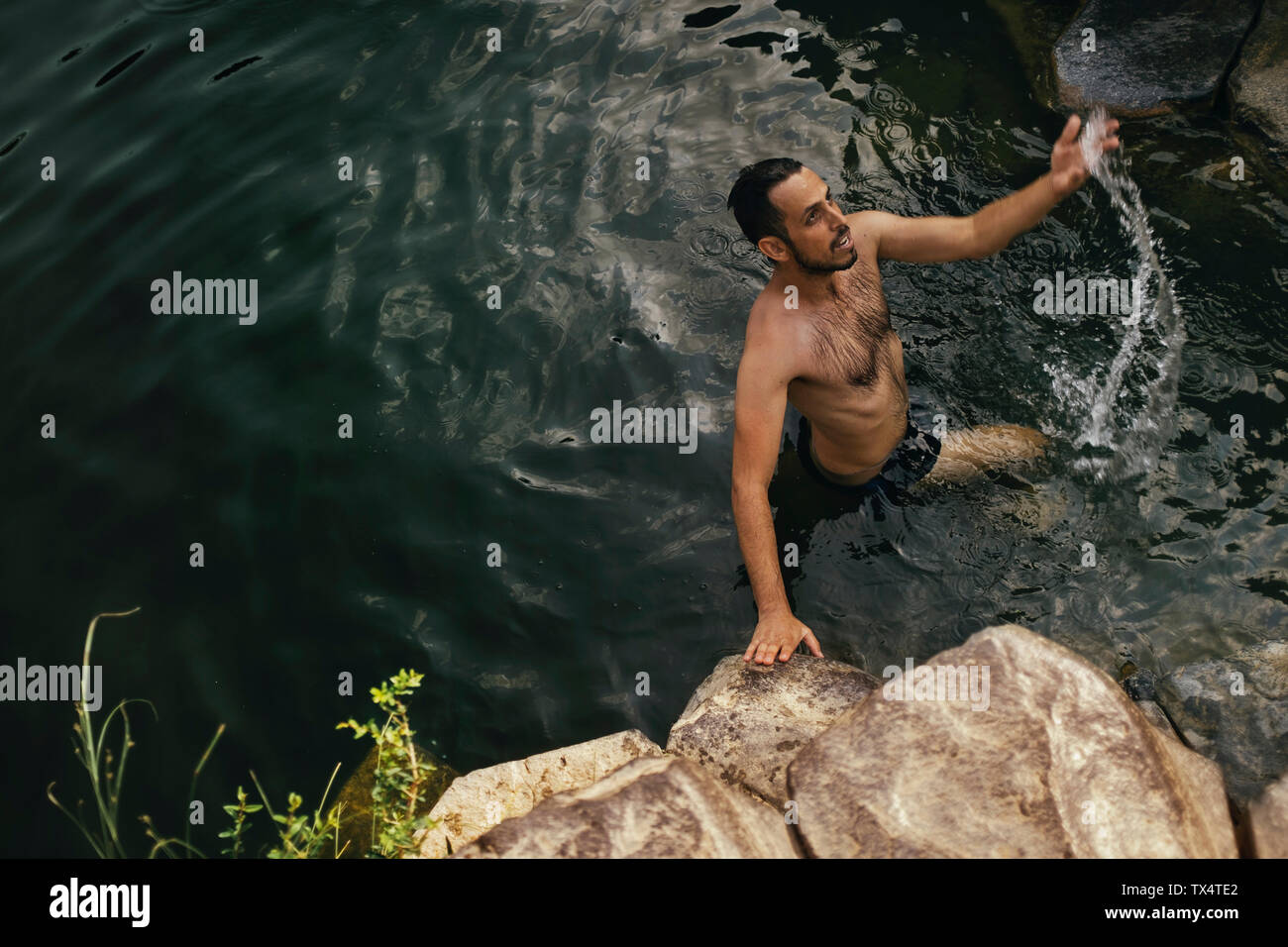 Man in the water, Yehudiya Reserve, Golan, Israel Stock Photo