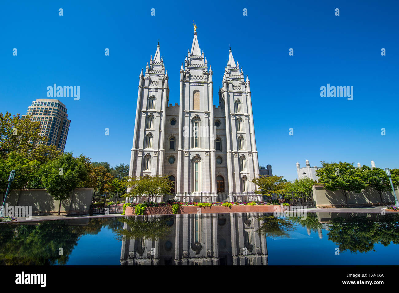 USA, Utah, Salt Lake City, Mormon Salt Lake City Temple reflecting in a little pond Stock Photo