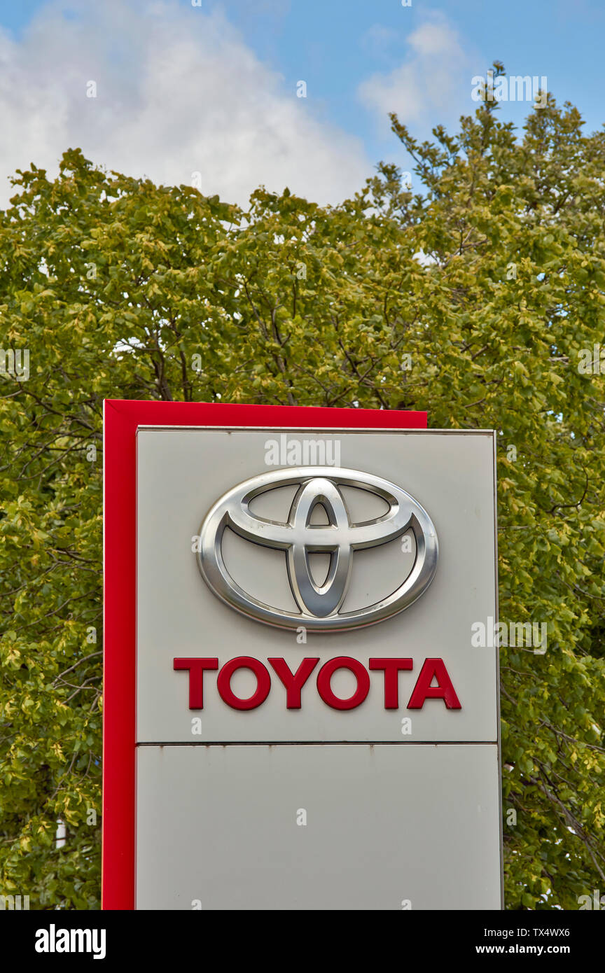 TOYOTA GARAGE SIGN  AND TREES IN SUMMER Stock Photo
