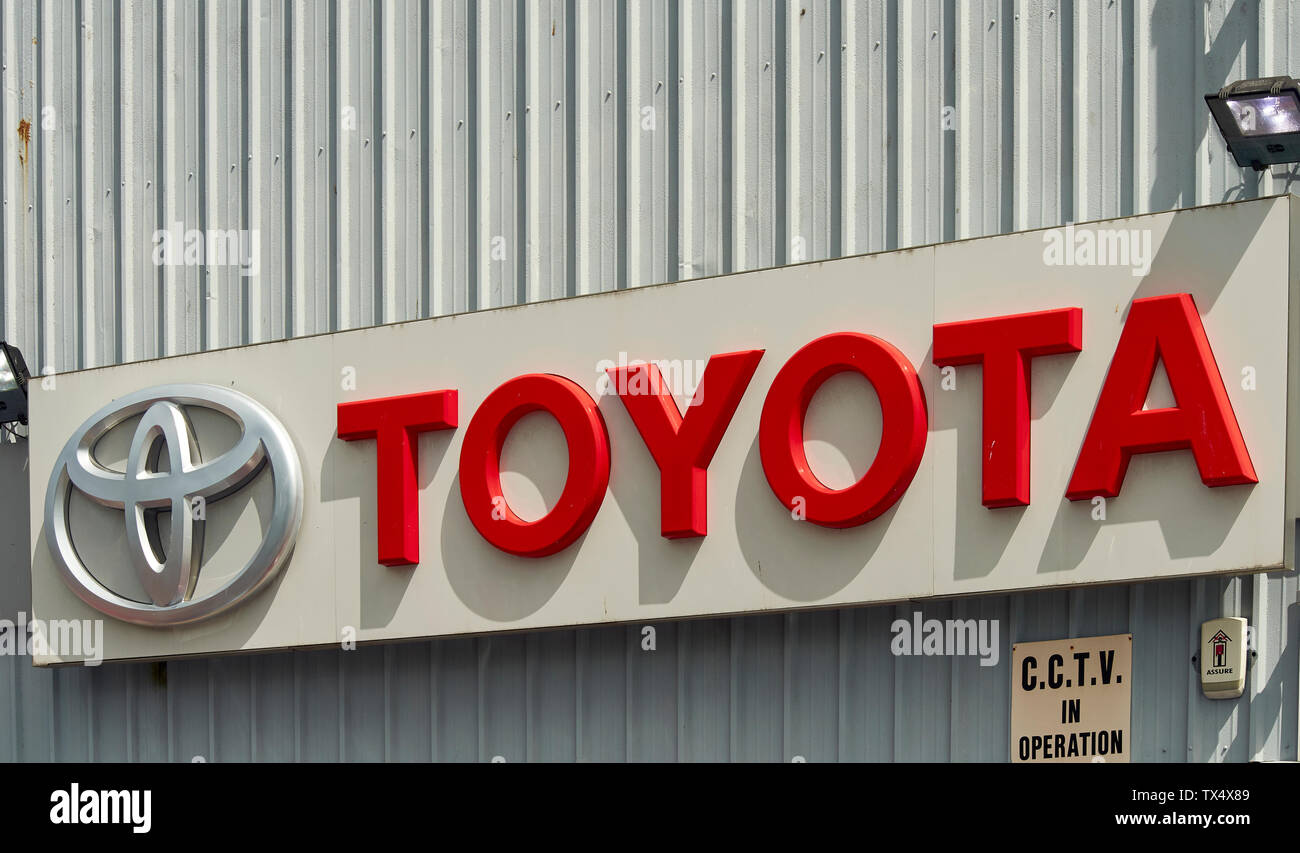 TOYOTA GARAGE SIGN  ON THE OUTSIDE  WALL OF THE MAIN BUILDING Stock Photo
