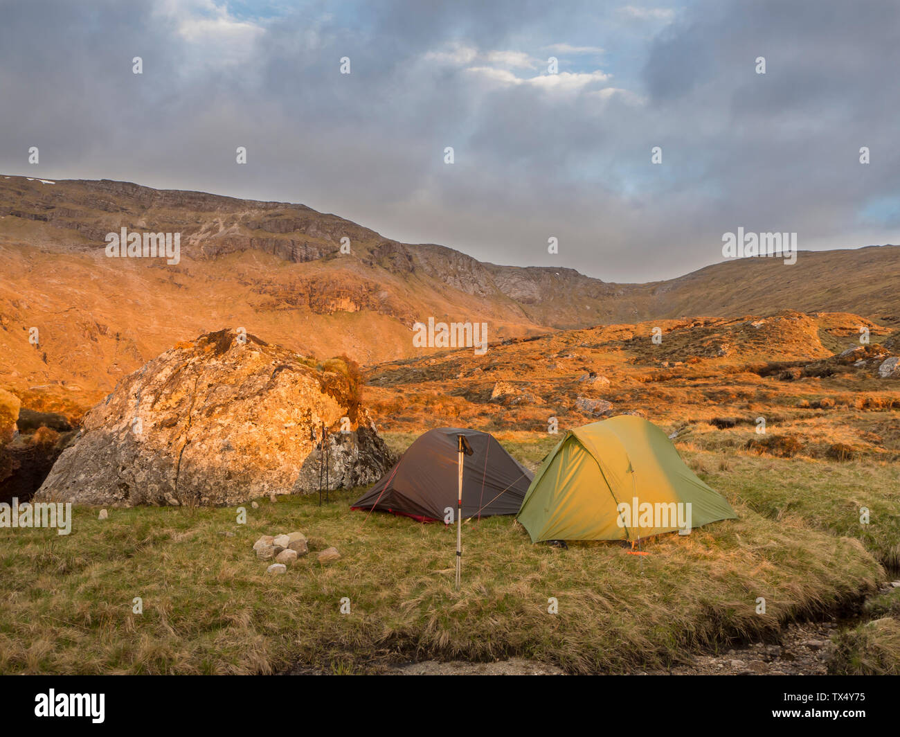 Great Britain, Scotland, Northwest Highlands, Ben More Assynt, mountainscape and tents in morning light Stock Photo