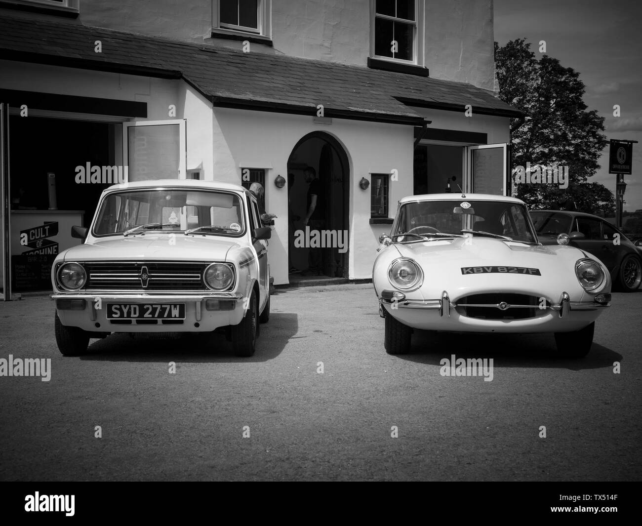 A classic Mini and a Jaguar E-Type on display at Caffeine & Machine in Ettington, UK Stock Photo