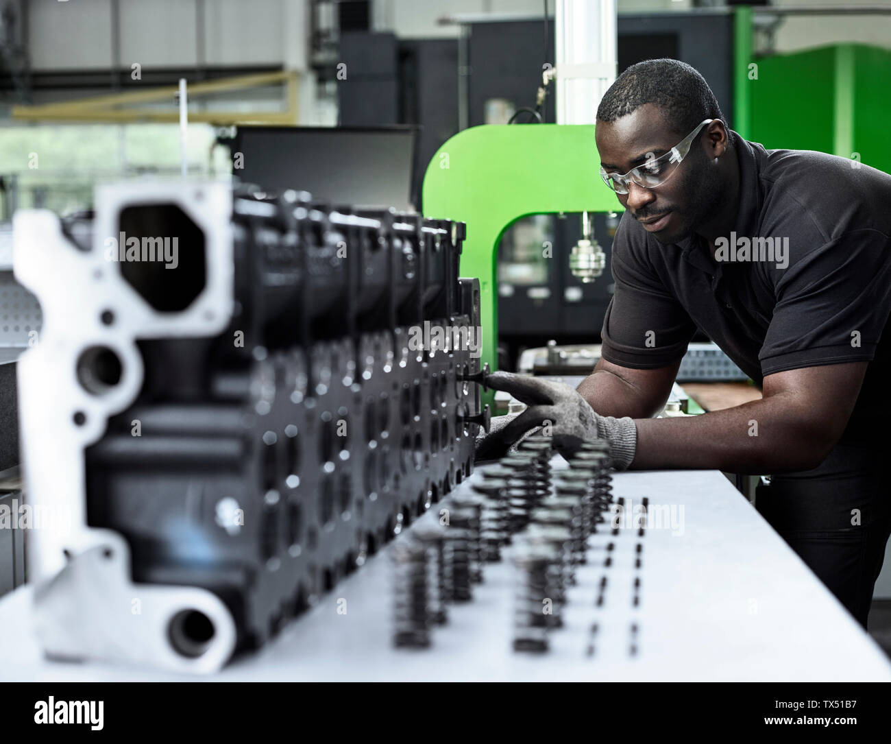 Man working, checking components Stock Photo