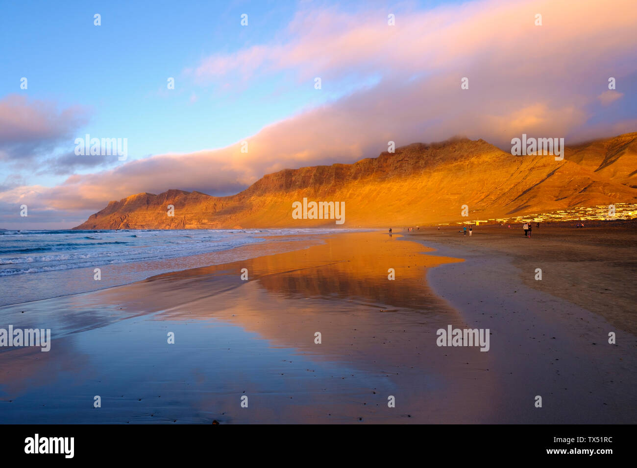 Spain, Canary Islands, Lanzarote, Caleta de Famara, beach in the evening light Stock Photo