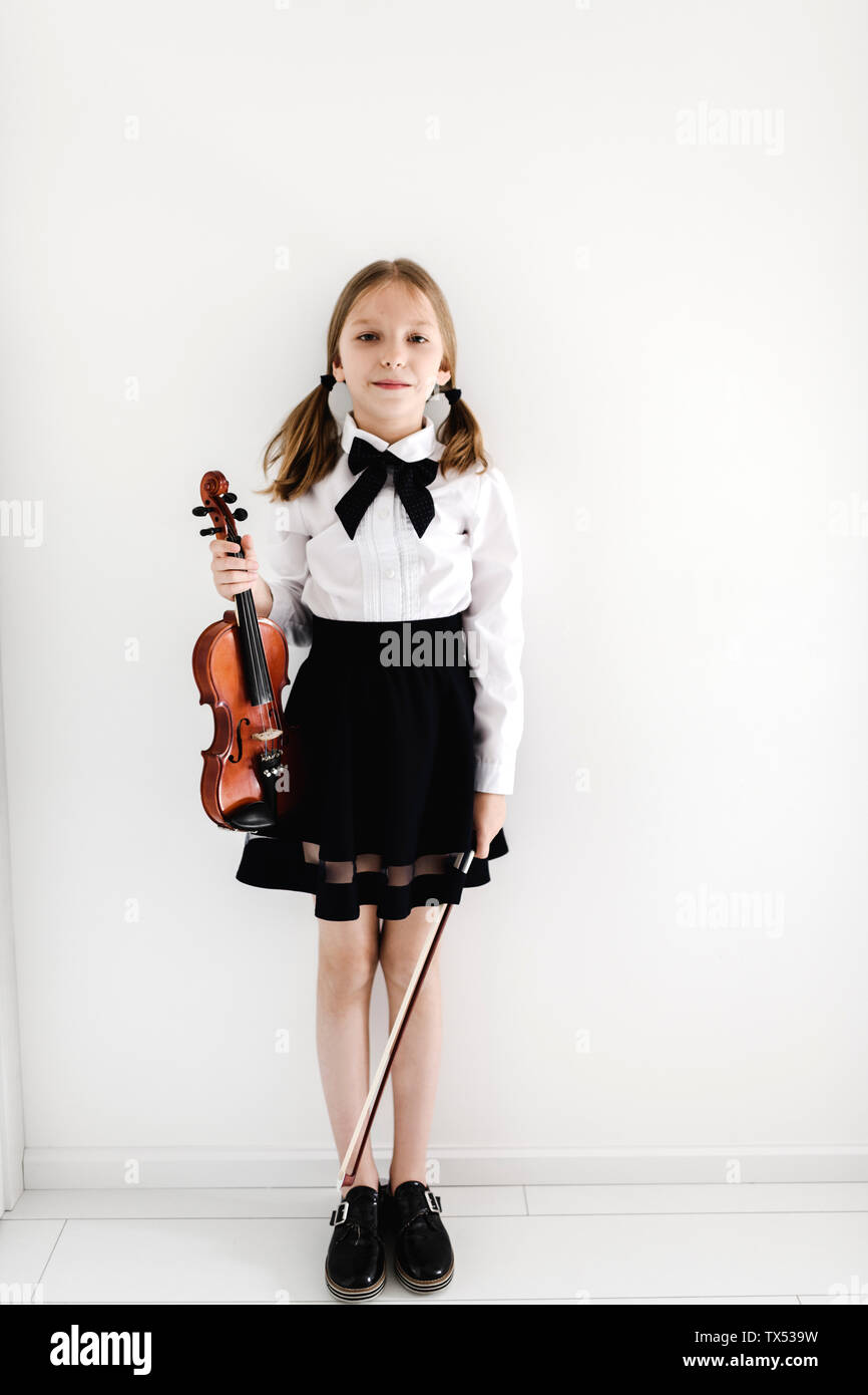 Portrait of girl holding a violin Stock Photo