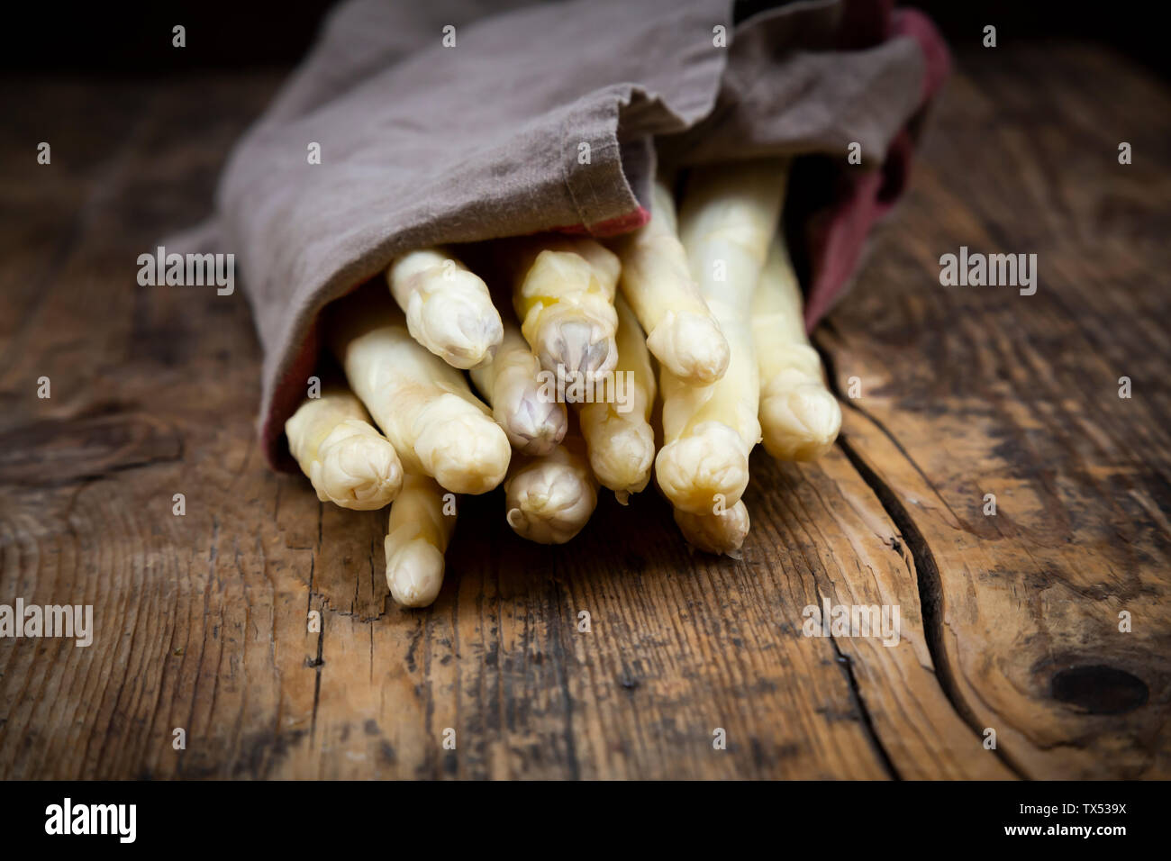 Bunch of white asparagus, kitchen towel Stock Photo