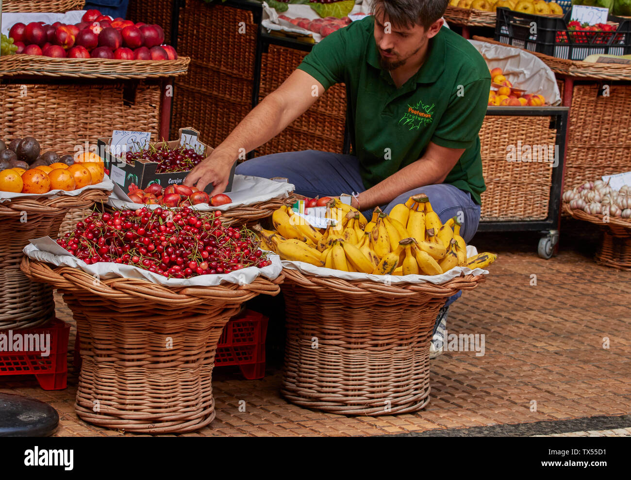 Stallholder and fruit in the Stock Photo