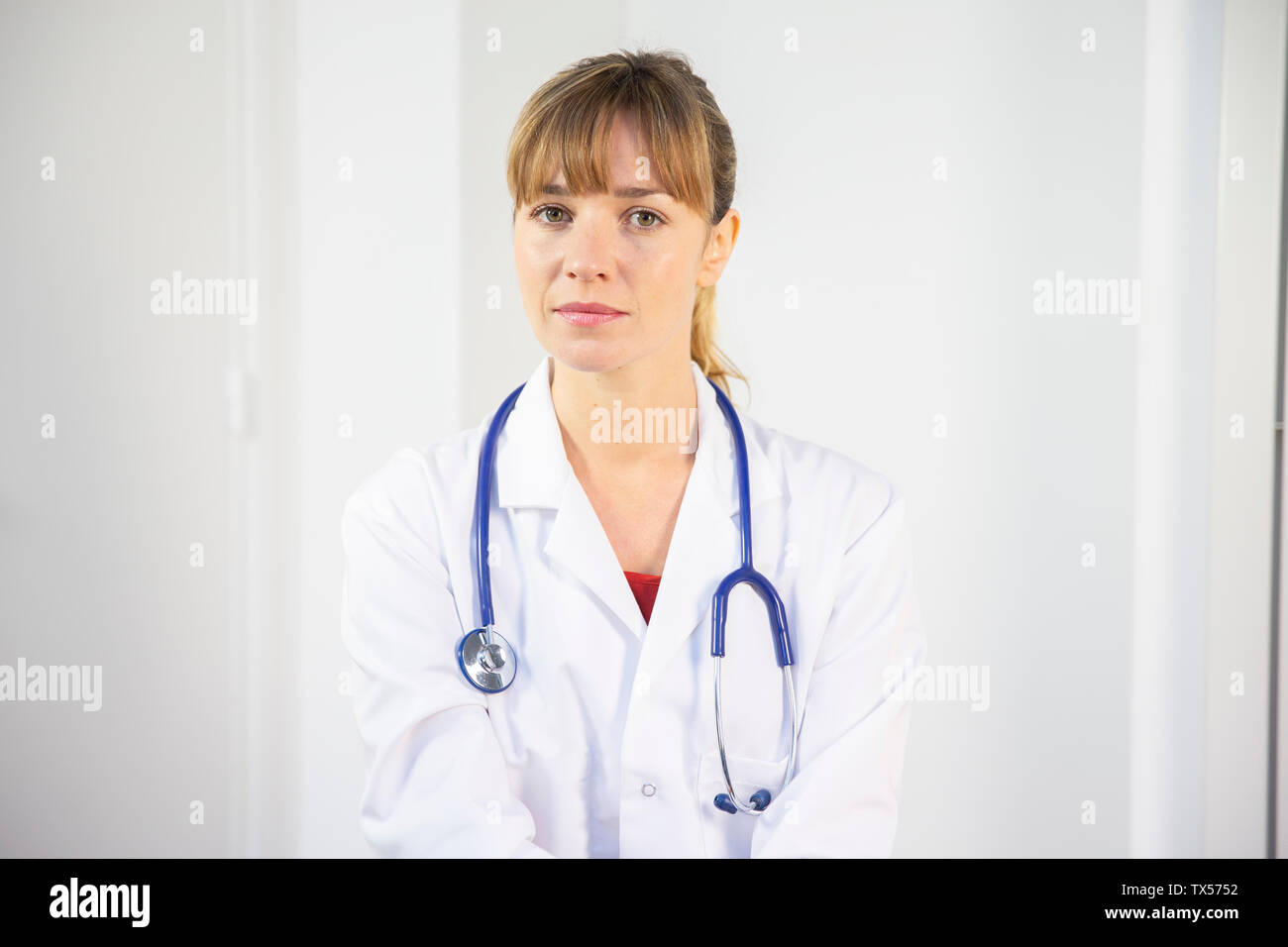 A female doctor in her white coat Stock Photo Alamy