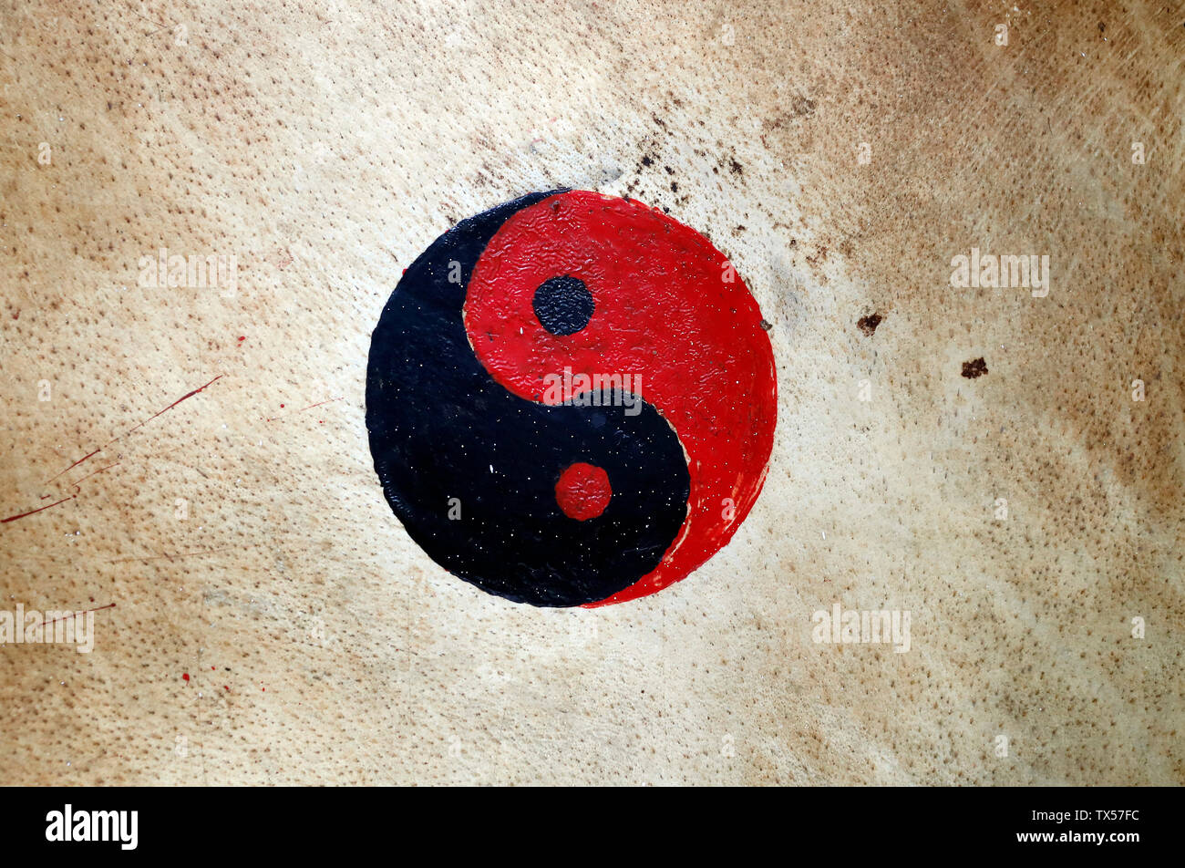 Ying and Yang symbols on a buddhist drum Stock Photo