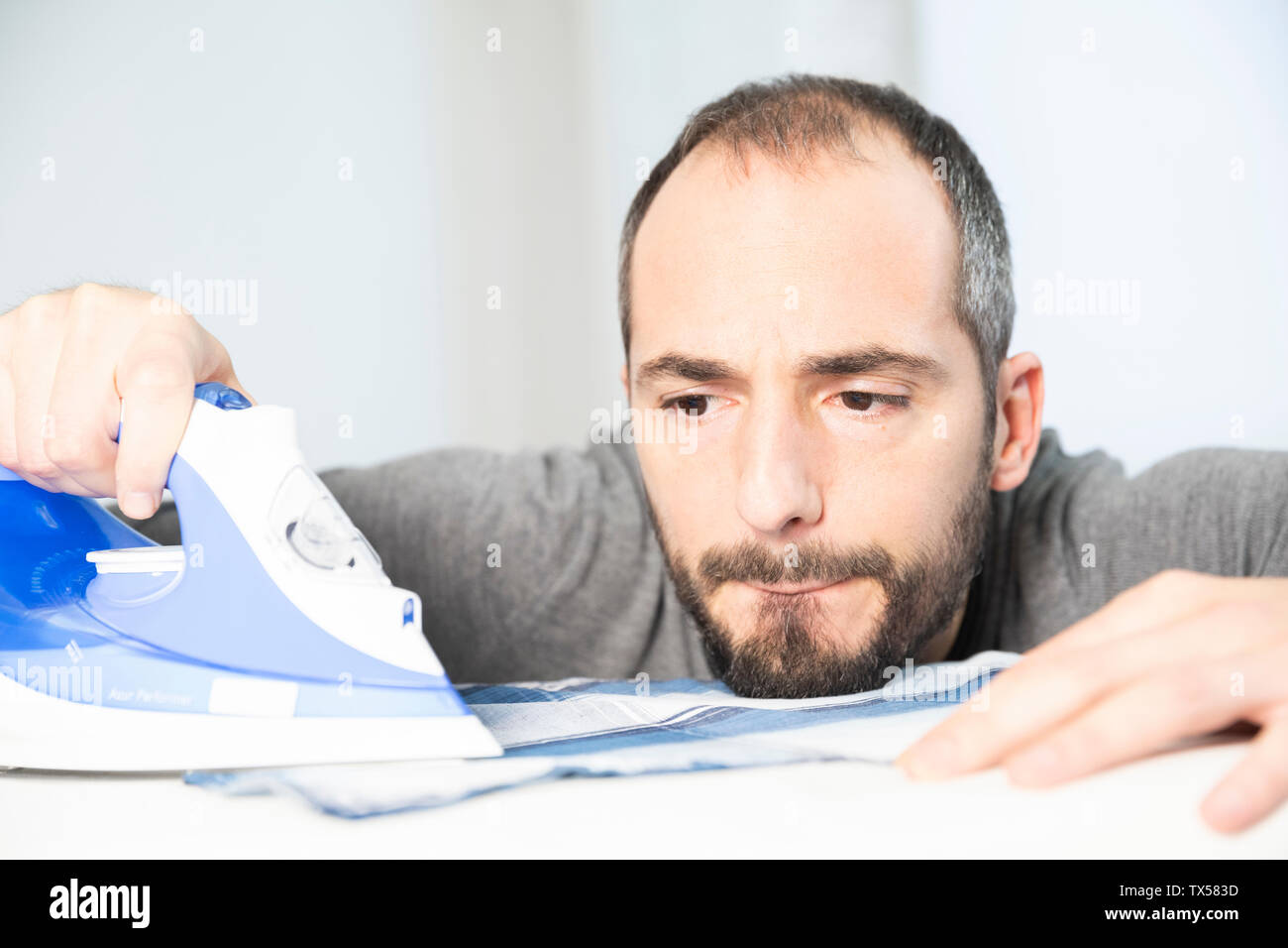A man ironing Stock Photo Alamy