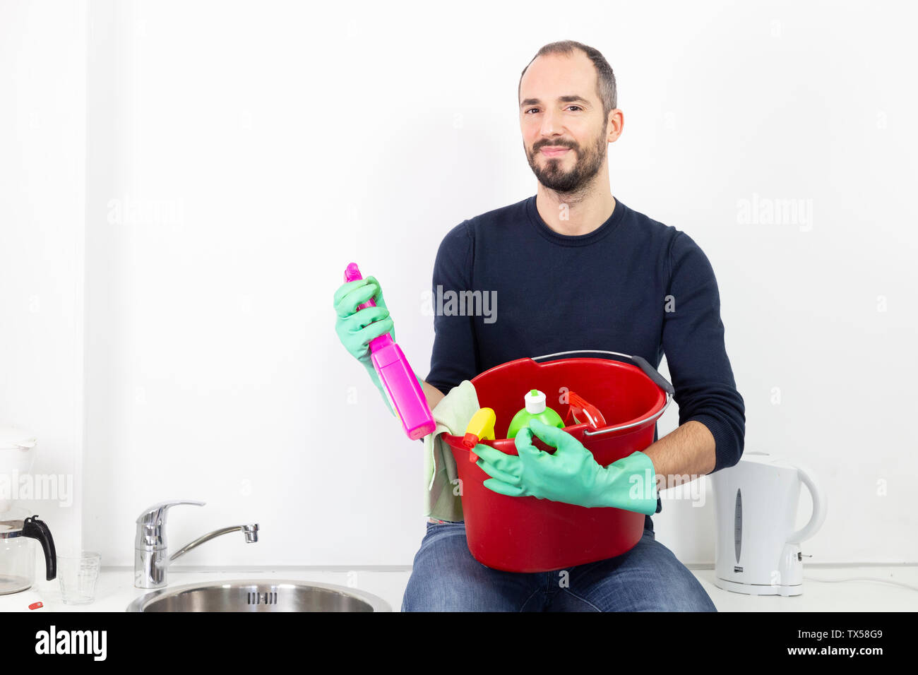A man with cleaning products. Stock Photo