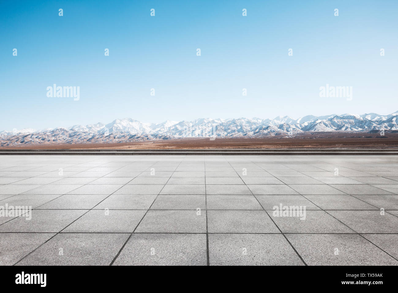 Empty floor with white snow mountains Stock Photo