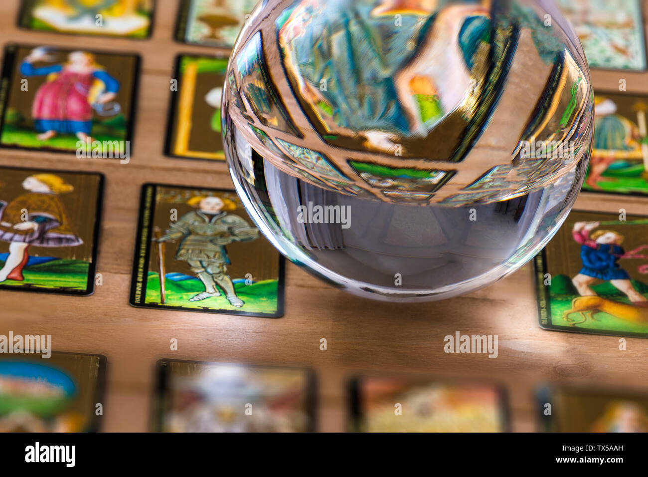 Fortune teller Crystal ball and in transparency tarot cards background . Stock Photo