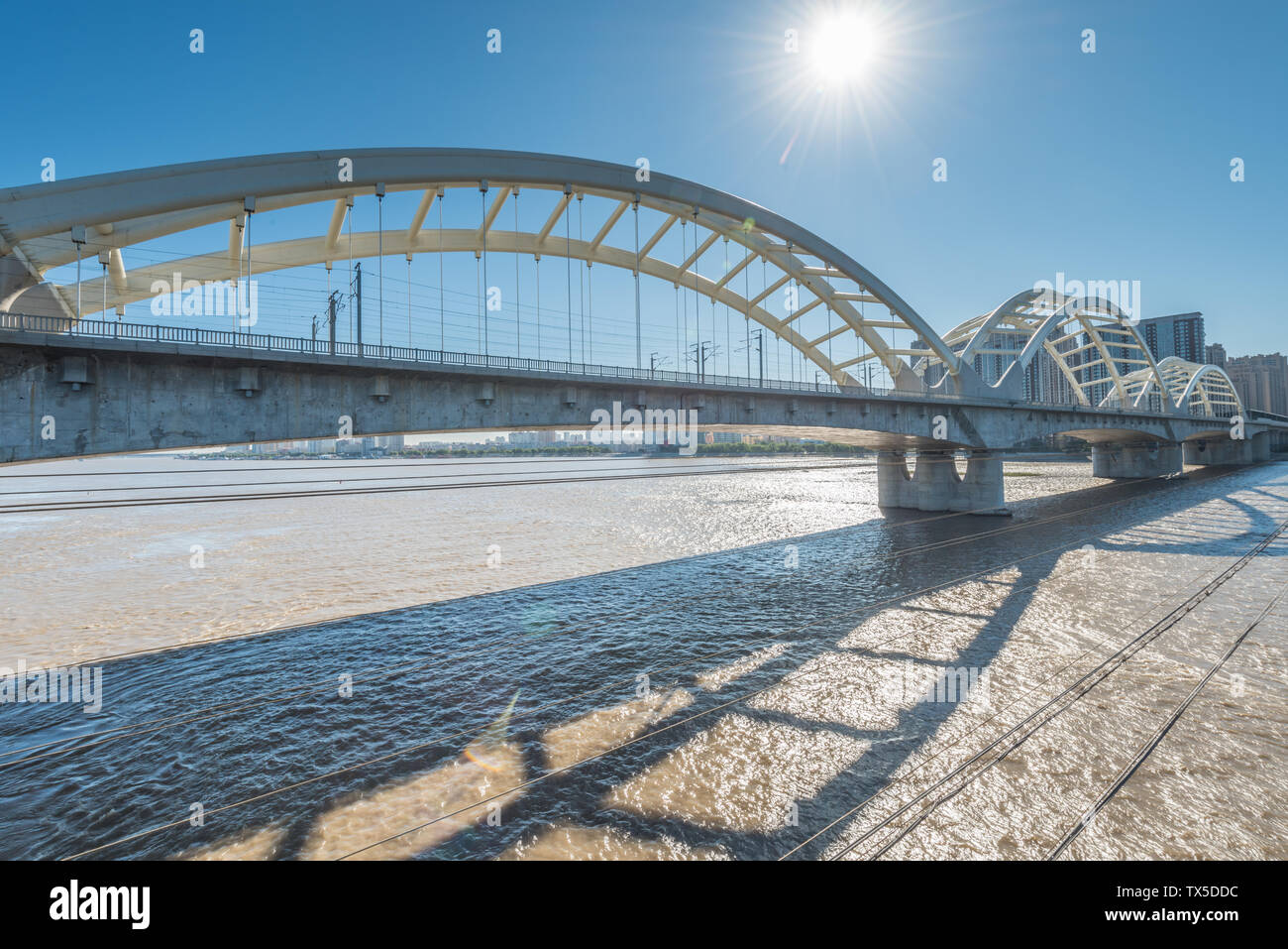 Songhua River Railway Bridge under Autumn Sunny Day in Harbin, China Stock Photo