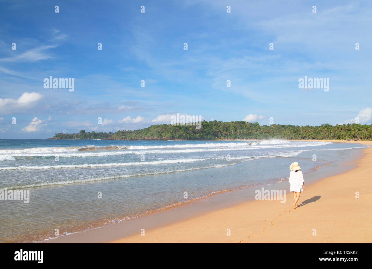 Woman on Talalla beach, Southern Province, Sri Lanka Stock Photo
