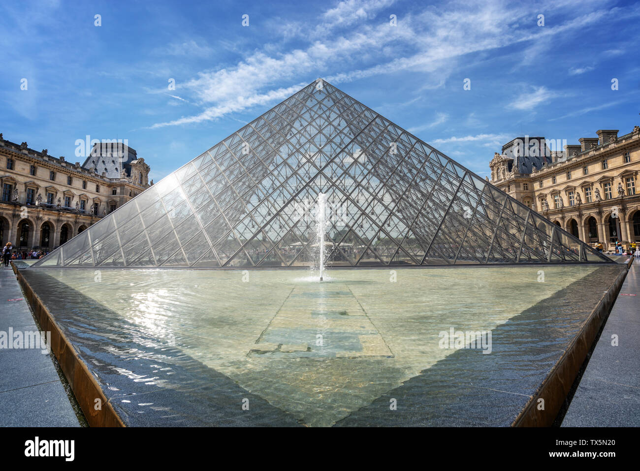 Louvre pyramid in the main courtyard of the Louvre Palace, Paris France Stock Photo