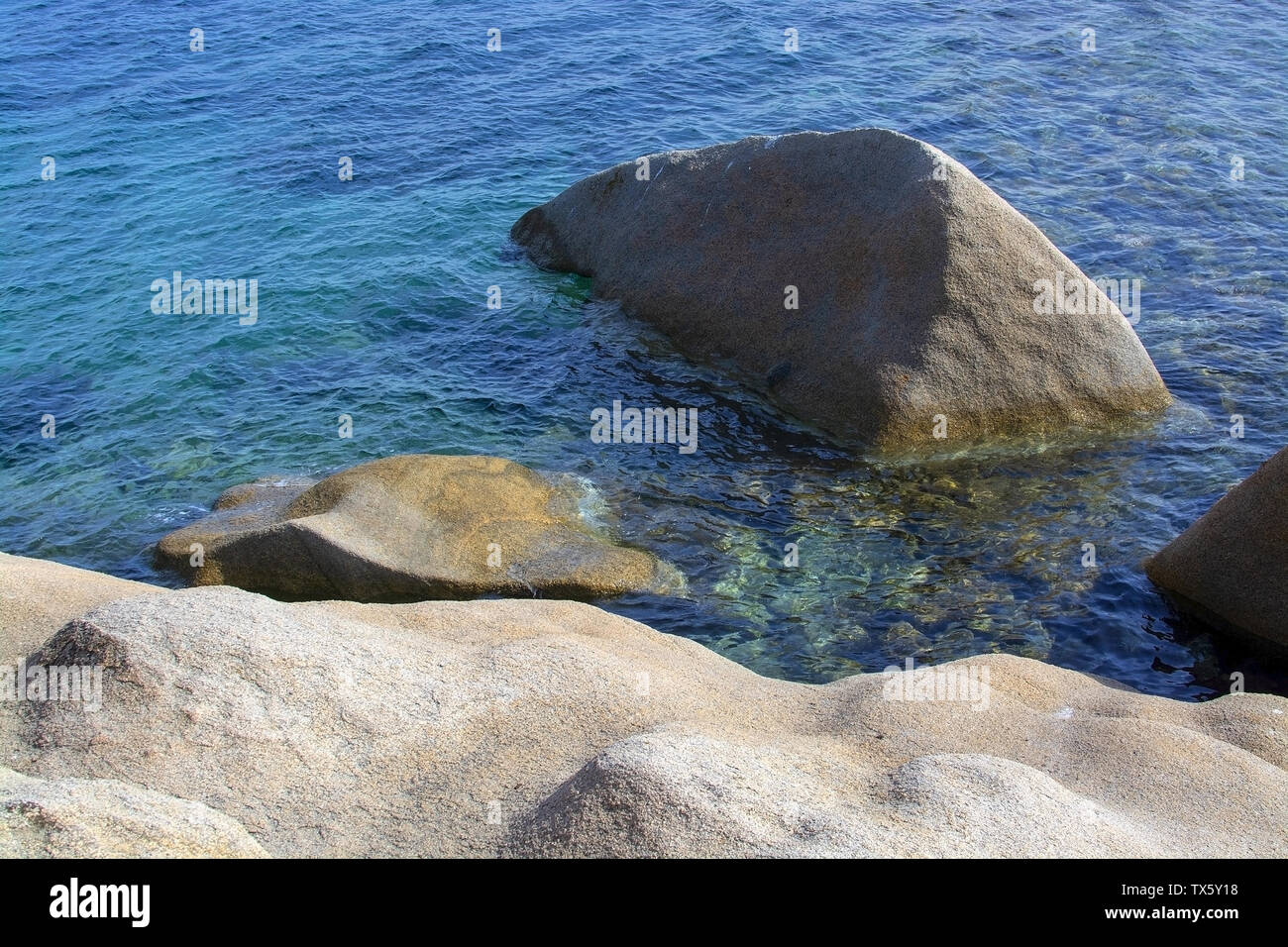 Beautiful smooth eroded granite rocks and green Mediterranean water in Costa Smeralda, Sardinia, Italy. Stock Photo