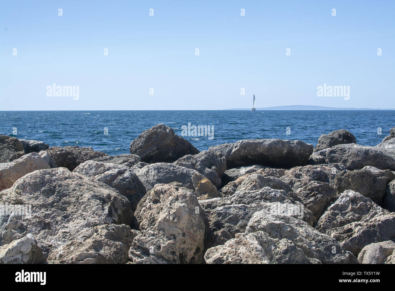 Limestone rocks seaside and blue Mediterranean sea in Mallorca, Spain. Stock Photo
